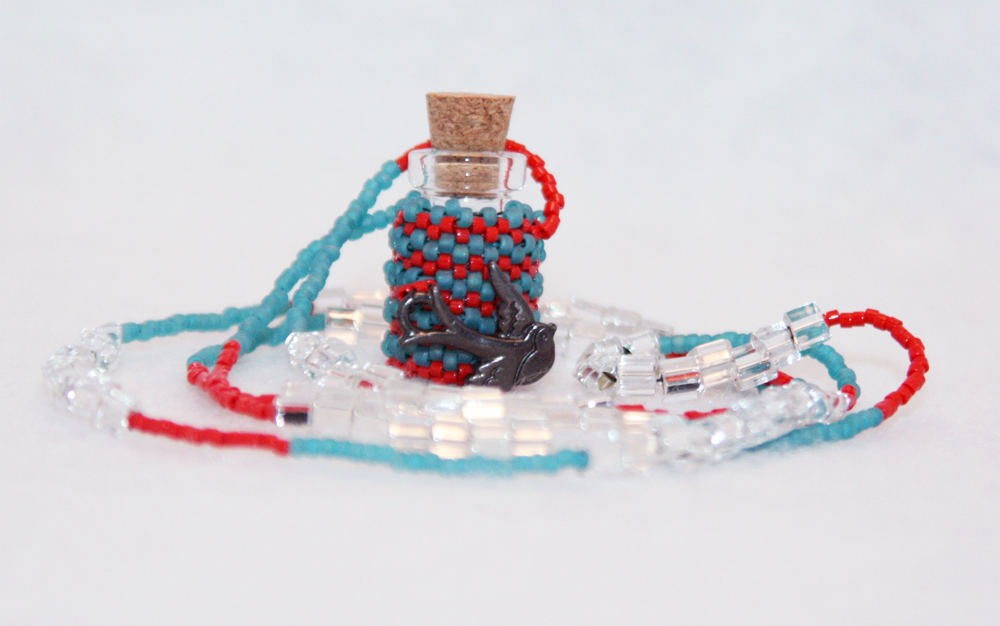 Beaded Bottle Necklace In Teal And Red With Bird Charm