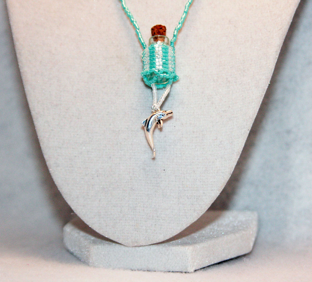 Beaded Fairy Bottle Necklace In Sea Green And White With Dolphin Charm