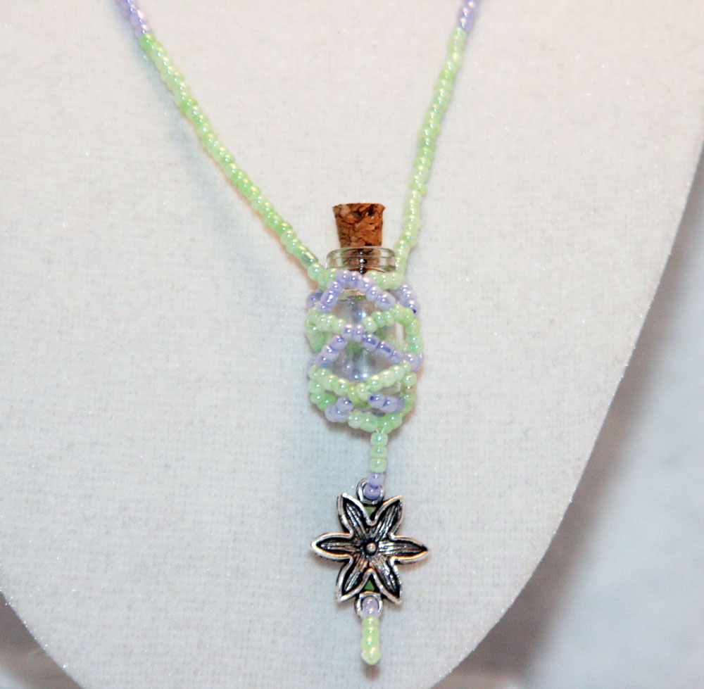 Beaded Bottle Necklace In Green And Purple With Silver Flower